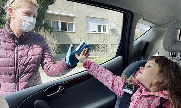 Picture shows a child in a car touching the window and a woman outside the car touching it from the other side. &nbsp;A mental health charity has seen a jump in calls for help from nurses whose well-being is affected by pressure of choices they have to make.