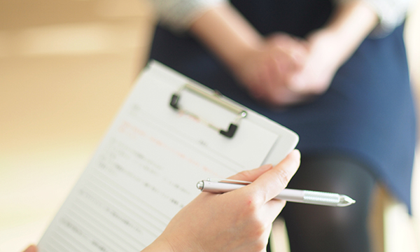 nurse completing paperwork