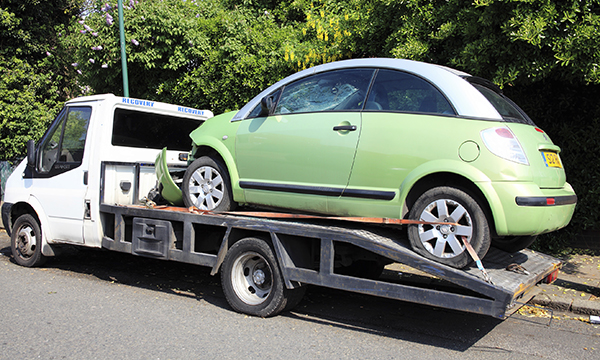 Car on back of pick-up truck