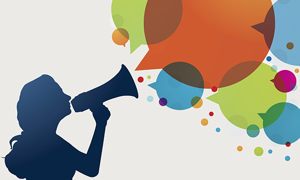 nurse speaks into a loud hailer