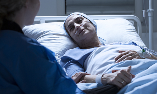 Nurse at the patient's bedside