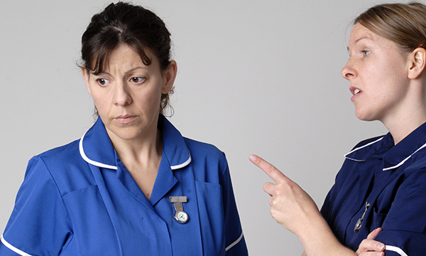 nurse is harangued by another
