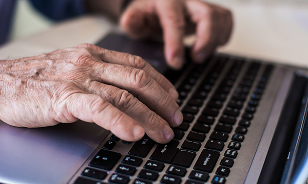 hand on a laptop keyboard