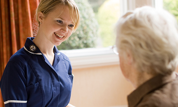 district nurse visits a patient