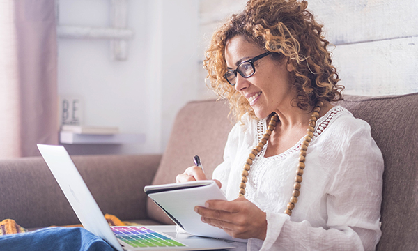 Woman studies on her laptop