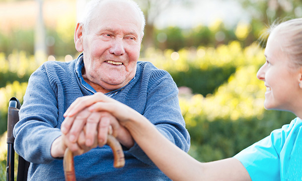 Older man with walking stick and nurse. Picture: iStock