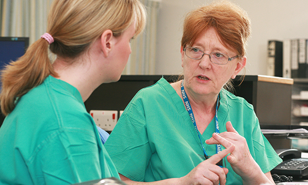 A mentor advising a nurse