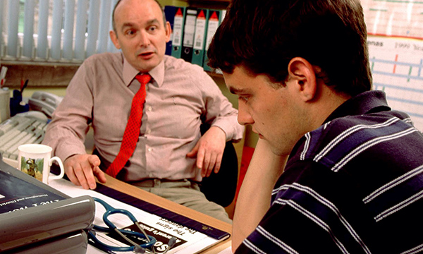 Pictures shows a GP talking to a young man. People with cancer who skip urgent referral appointments for their symptoms are more likely to die within a year of diagnosis, researchers say