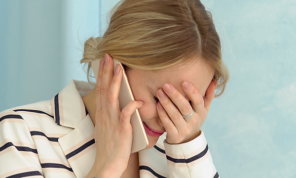 Distressed woman on the phone