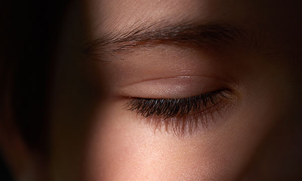 Picture is partial shot of woman’s face with her eye closed. Collaborating with service users on sleep issues is crucial to care outcomes, says occupational therapist Jessica Oglethorpe