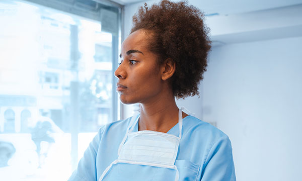 Head shot of a BAME nurse during the COVID-19 pandemic