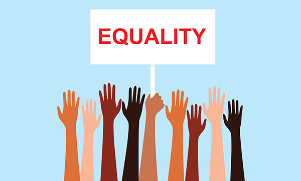 hands suggesting diverse racial heritage raised below a banner that reads 'Equality'
