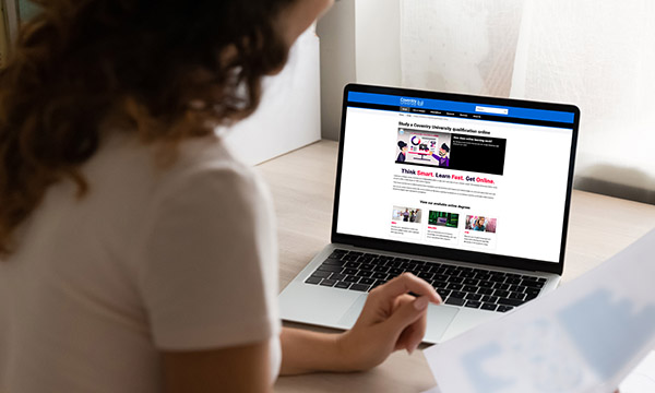woman studies on a laptop as Coventry University announces UK's first online nursing degrees