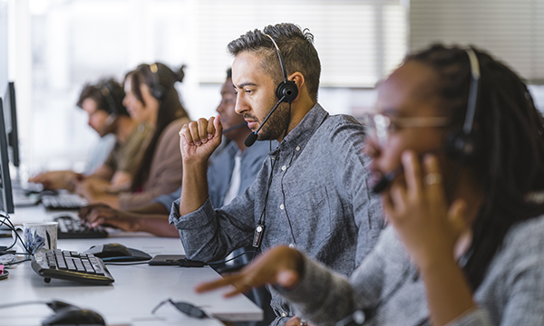Staff at phone call centre handle calls from the public