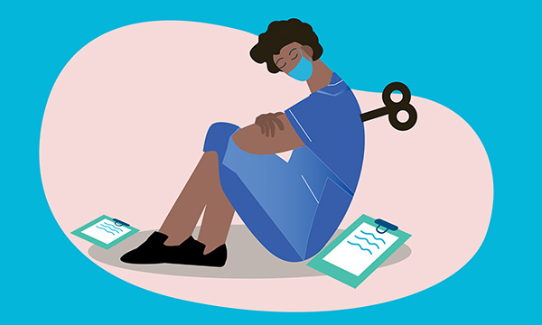 Exhausted nurses sits slumped on the floor