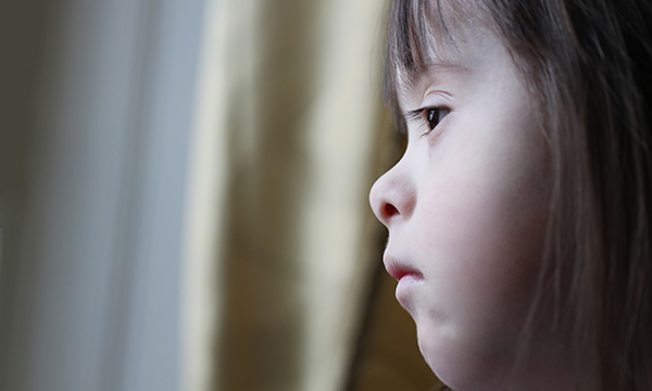 Girl looking out of window