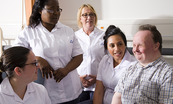 Picture shows a group of nurses with patient with a learning disabilities