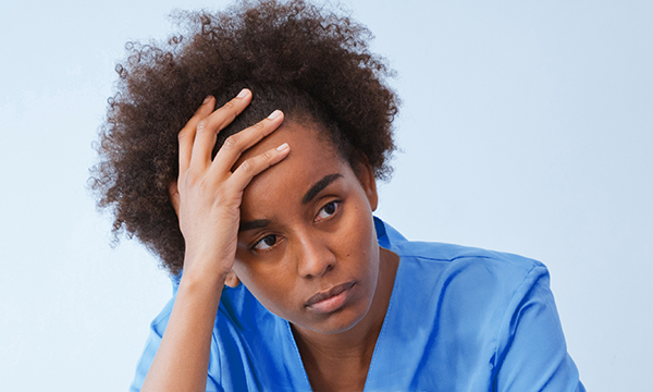 Nurse looks tired and stressed as NHS managers say burnout is worrying them