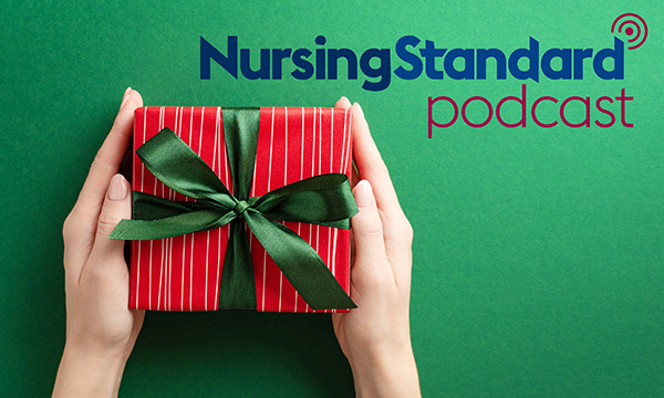 Hands holding a gift box wrapped in ribbon