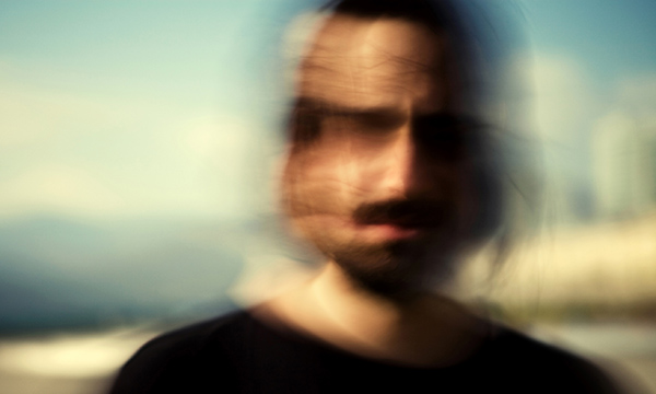 Blurred picture of man’s heading turning depicting someone who hears voices