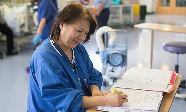 Ward nurse making notes