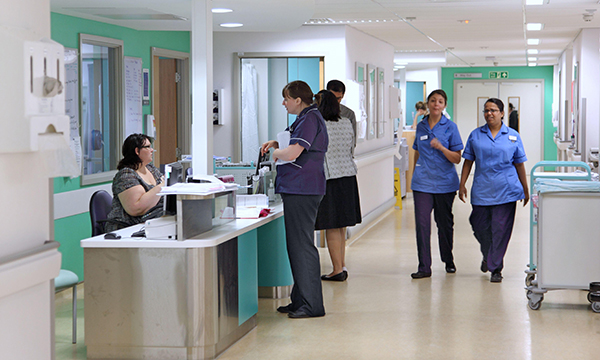 Photo of nurses in hospital, illustrating story about a short staffing survey