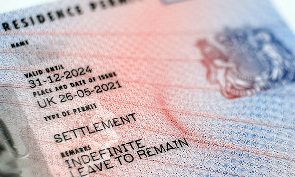 Close-up of a passport visa with proof of an indefinite leave to remain