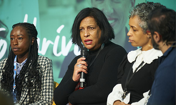 Michelle Cox talking at Nursing Live 2023 pictured alongside other speakers on the panel discussion