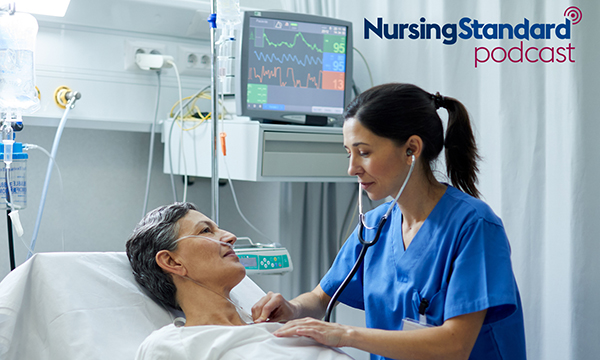 A medic examines a patient lying in a hospital bed