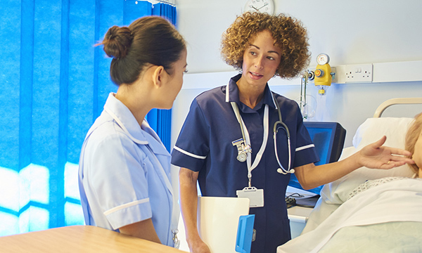 Photo of nurse recruit being trained, illustrating story about competency courses for overseas nurses