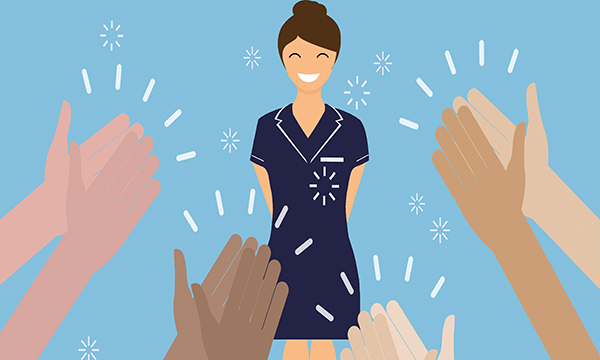 An illustration showing a smiling nurse in uniform standing in front of a crowd, represented by several sets of hands raised high and clapping