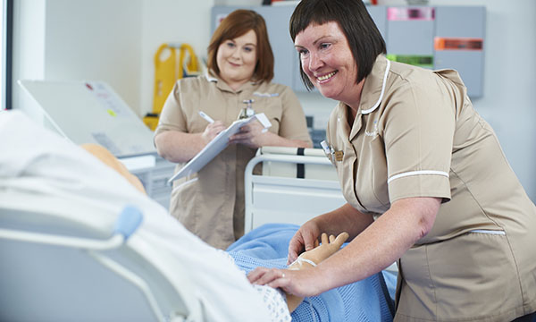 Photo of nurse associate students in training, illustrating story about their introduction in Wales