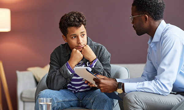 An adolescent is given counselling on the late effects of cancer treatment
