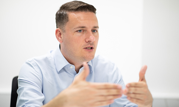Close-up of West Streeting during the interview at St Mary’s Hospital in London, gesturing with his hands to emphasise a point