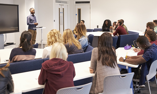 Academic clinicians: not every nurse has been an academic, but it often feels like every academic has been a nurse – picture shows students taking notes in a lecture hall