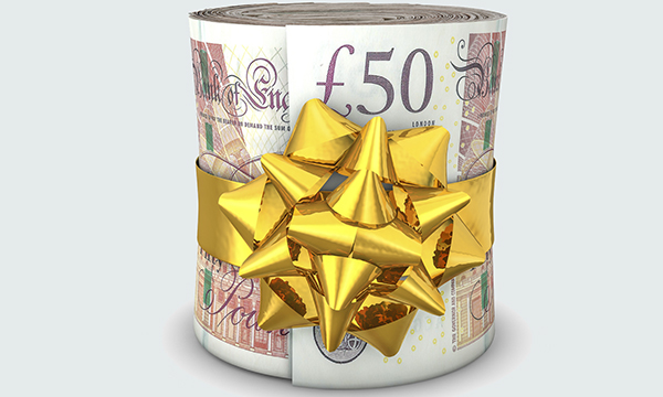 Rolled up fifty pound notes tied with ribbon 