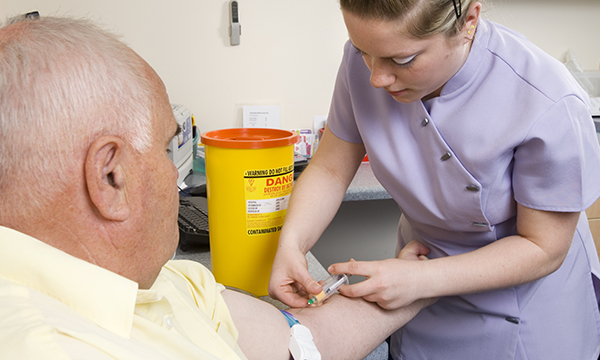 Not all nursing students will have the opportunity to practise venepuncture and cannulation on clinical placement. A nurse is shown performing venepuncture on an older patient