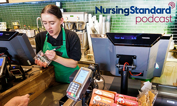 Newly qualified nurses are taking jobs in coffee shops. Picture shows a young woman writing a name on a plastic coffee cup while serving a customer