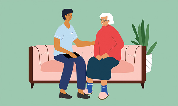 Compassionate communication with patients: illustration of a community nurse sitting on a sofa with a patient and putting their hand on their arm