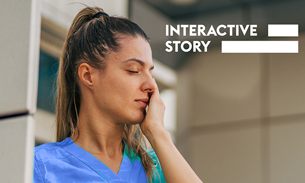 Nursing in corridors: An exhausted and dispirited nurse rubs her eye 