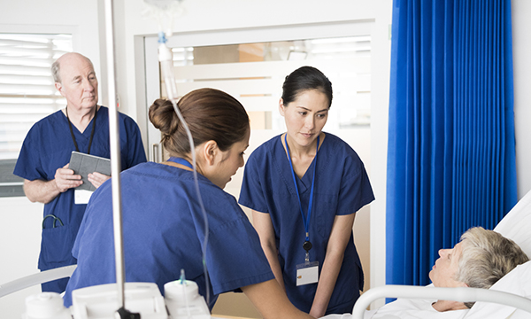 Nurse handover at the bedside: nursing team meets at patient’s beside