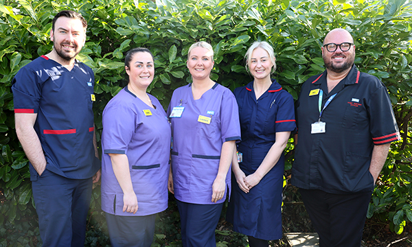 Matrons and ward leaders at Wrightington, Wigan and Leigh Teaching Hospitals NHS Foundation Trust sport their new uniforms, led by chief nursing officer Kevin Parker-Evans