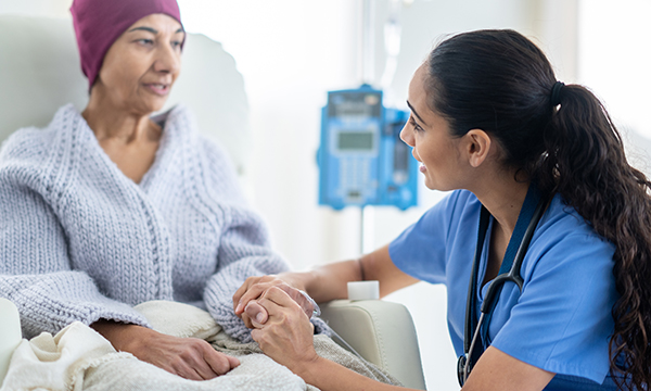 A clinical nurse specialist uses her expertise to provide emotional support to a cancer patient