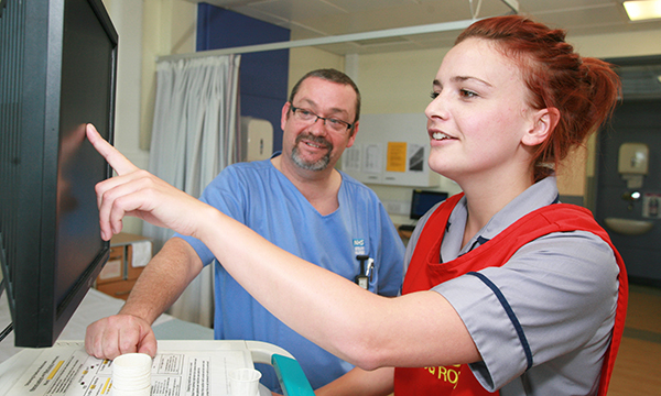 Final clinical placement: a nursing student carries out a drug round on a hospital ward while being supervised by a nurse