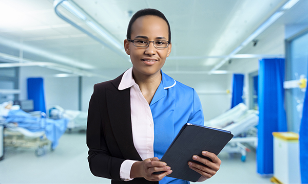 Portfolio nursing career: a smiling nurse dressed half in blue uniform, and half in a suit, to illustrate pursuing a portfolio career as a nurse and a manager
