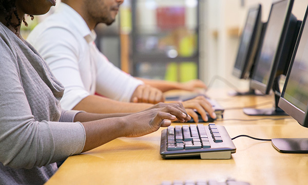 Test centre fraud: someone completing an online test on a laptop