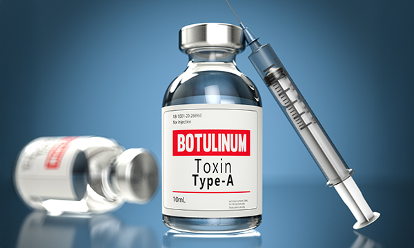 A vial of Botox with needle