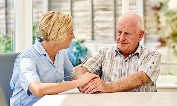 nurse talks to patient