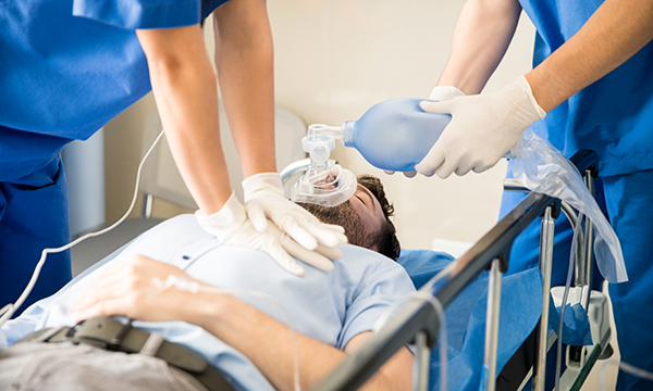 man receiving chest compressions