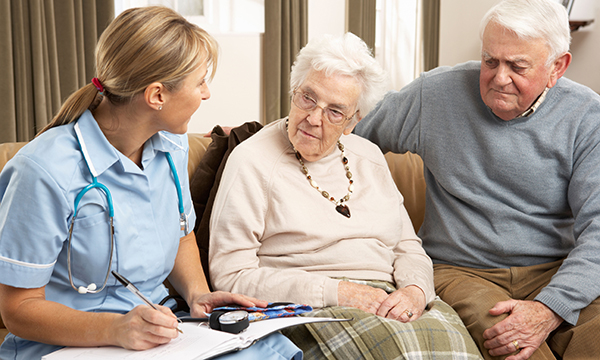 Nurse talks to couple